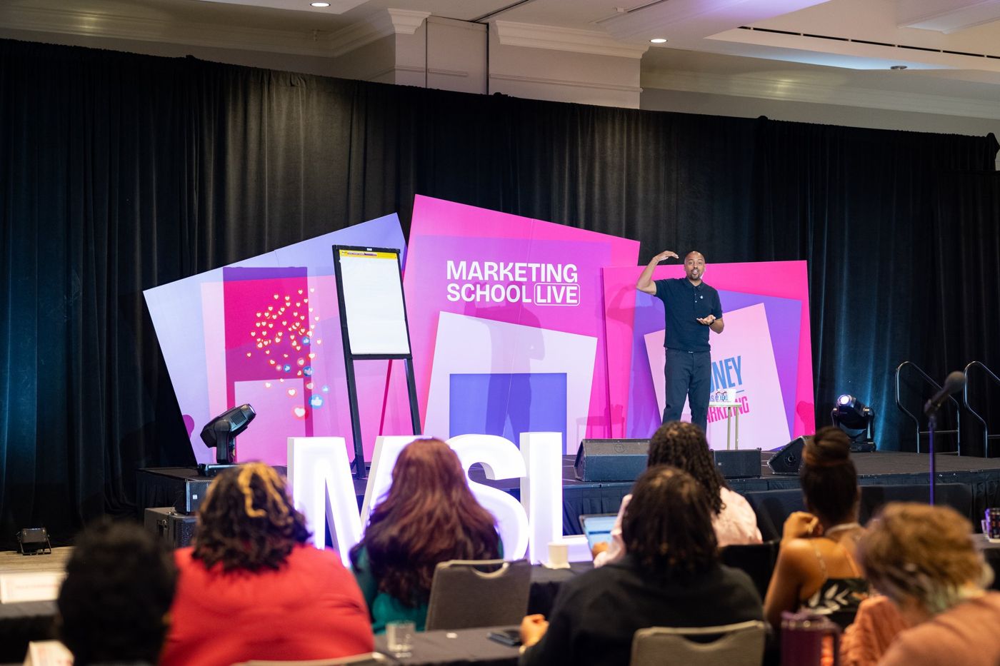A speaker teaching on the MSL stage