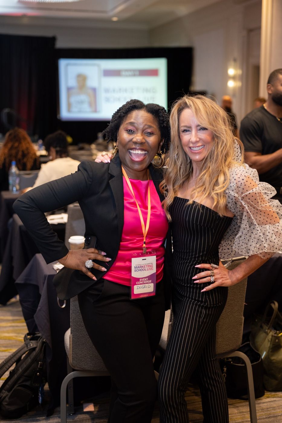 Two attendees celebrating together