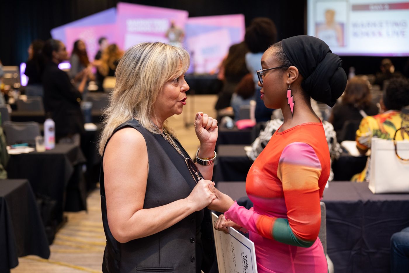Two attendees in conversation